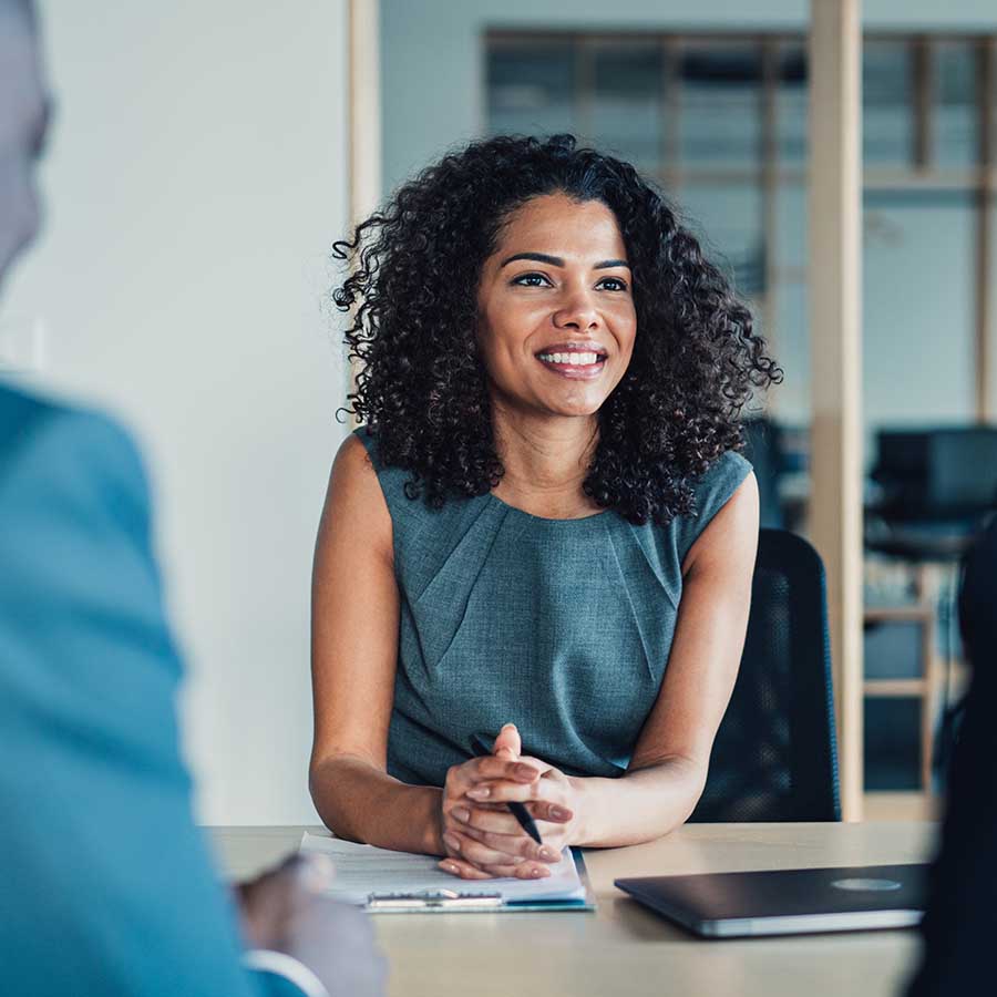 Shot of group of business persons in business meeting. Three entrepreneurs on meeting in board room. Corporate business team on meeting in modern office. Female manager discussing new project with her colleagues. 