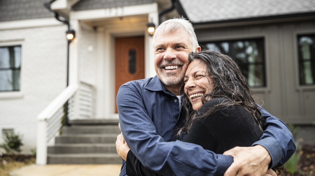 man and woman hugging